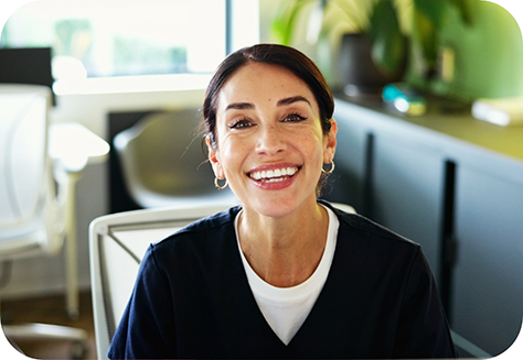 Close up of smiling woman sitting down