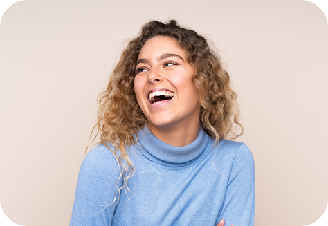 Woman in blue sweater laughing