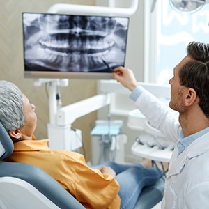 Emergency dentist in El Cajon examining patient's tooth during urgent visit 