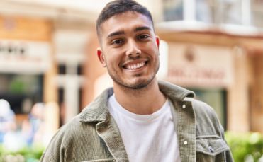 Man standing outside and smiling