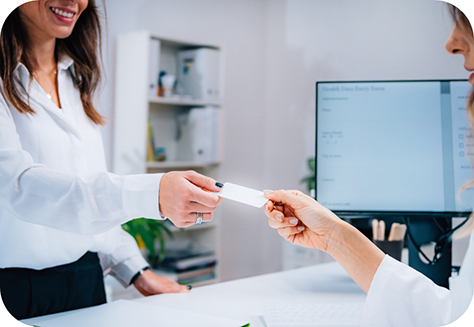 Taking credit card from dental patient